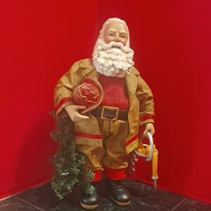 Clothtique Fireman Festive Santa Claus Figurine in Gold and Red